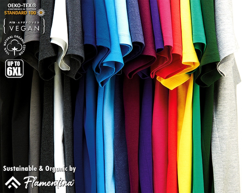 May include: A variety of t-shirts in different colors, hanging on a rack. The shirts are made of organic cotton and are certified vegan. The shirts are available in sizes up to 6XL. Oeko-Tex Standard 100, PITA Approved, Vegan, 100% Natural Organic Cotton, Up to 6XL, Sustainable & Organic by Flamentina.
