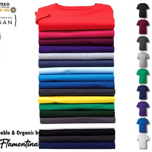 May include: A stack of 18 t-shirts in various colors, including red, pink, purple, gray, blue, yellow, green, black, and white. The shirts are made of organic cotton and are certified vegan. The shirts are available in sizes up to 6XL. The text "Sustainable & Organic by Flamentina" is at the bottom of the image.