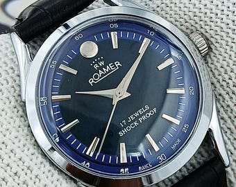 Vintage Roamer Swiss Made handopwindbaar mechanisch herenhorloge blauwe wijzerplaat gebogen lugs 17 juwelen roestvrij staal gerenoveerd cadeau voor hem 2414
