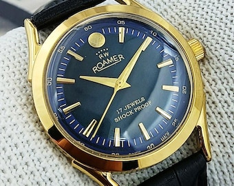 Reloj mecánico vintage Roamer de cuerda manual para hombre, fabricado en Suiza, esfera azul, asas curvas, 17 joyas, chapado en oro, restaurado. Ideal como regalo para él. Modelo 230-01