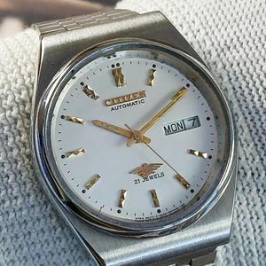 希少 新品未使用 シチズン 21石 イーグル7 自動巻き フルーデットベゼル CITIZEN - CITIZEN イーグル7 自動巻き腕時計 デイデイト