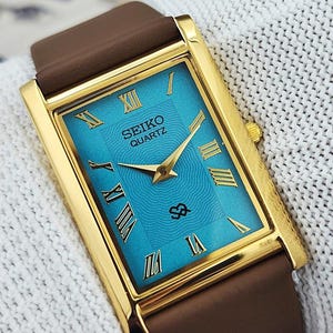 Klasyczny zegarek męski Seiko Slim Tank Quartz Japan z niebieską tarczą rzymską, prezent dla niego i dla niej 1000-07