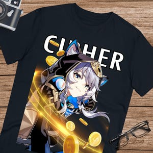 Puede incluir: Camiseta negra con un gráfico de un personaje con cabello blanco, detalles azules y una capa con capucha. La palabra "CIPHER" está impresa en blanco encima del personaje. Monedas de oro y líneas de luz emanan del personaje.