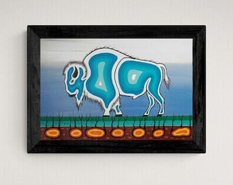 May include: A framed painting of a blue and white bison with a black frame. The bison is standing on a brown and orange ground.
