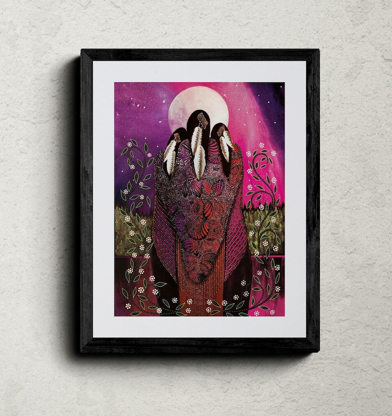 May include: Framed art print featuring three figures in ornate, patterned garments, adorned with feathers. The artwork is set against a backdrop of a full moon and a vibrant, star-filled sky, with floral accents framing the figures.