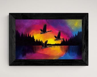May include: A framed painting depicting a colourful sunset over a lake, with three black silhouettes of geese flying in formation. The sky is a blend of purple, pink, orange and yellow.