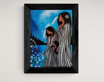 May include: A framed painting depicting three Indigenous women in traditional clothing, standing in a woodland setting with a blue sky and white flowers. The women are wearing white and black beaded dresses with feathers in their hair.