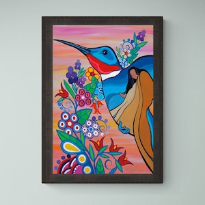 May include: A framed painting depicting a colourful hummingbird with a woman in a brown dress. The hummingbird is flying towards the right side of the painting. The background is a pink and orange gradient with flowers and leaves in various colours.