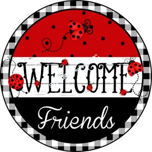 May include: A round welcome sign with a black and white checkered border. The sign has a white wooden plank background with the word "WELCOME" in black script. The word "Friends" is written in black script below the word "WELCOME". The sign is decorated with red ladybugs with black spots.