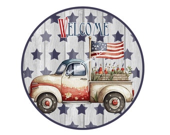 May include: A white vintage pickup truck with red, white, and blue accents, carrying a wooden crate filled with flowers and red berries. The truck is on a wood background with blue stars and the word "WELCOME" in red and blue letters.