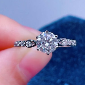 Round Cut Moissanite Ring: Sterling Silver Band, CZ Accents