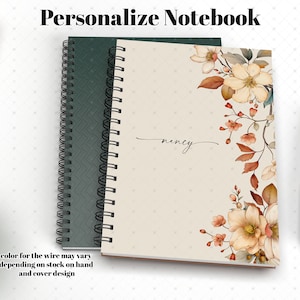 May include: A personalized notebook with a beige cover featuring a floral design in shades of brown, orange, and white. The notebook has a spiral binding and the name "nency" is written in cursive on the front cover.