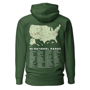 May include: A green hooded sweatshirt with a map of the United States showing the locations of all the national parks. The text "US National Parks" is printed on the sweatshirt, along with a list of all the national parks.