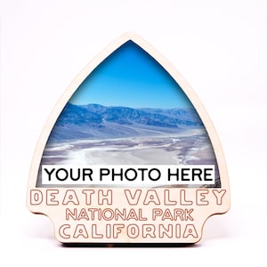 May include: Wooden sign shaped like a mountain peak with a photo of Death Valley National Park in California. The sign says "Your Photo Here" and "Death Valley National Park California".
