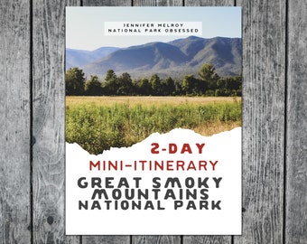 May include: A white poster with a torn edge, featuring a photo of a mountain range with a green field in the foreground. The poster has red text that reads "2-DAY MINI-ITINERARY GREAT SMOKY MOUNTAINS NATIONAL PARK".