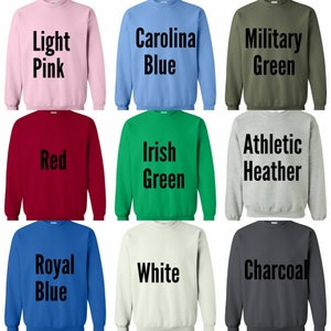 May include: Nine different color sweatshirts with text on the front. The colors are light pink, Carolina blue, military green, red, Irish green, athletic heather, royal blue, white, and charcoal.