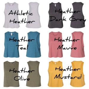 May include: Six cropped tank tops in different colours. The colours are athletic heather, heather dark grey, heather teal, heather mauve, heather olive and heather mustard.