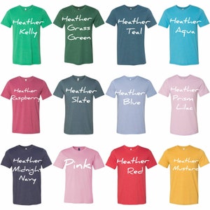 May include: Twelve different colored t-shirts with the word "Heather" and a color name written in white on each shirt.