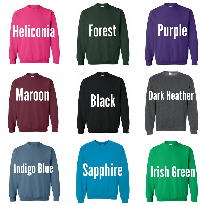 May include: Nine different color crew neck sweatshirts. The colors are Heliconia, Forest, Purple, Maroon, Black, Dark Heather, Indigo Blue, Sapphire, and Irish Green.