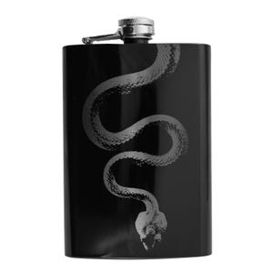 May include: Black stainless steel flask with a silver cap and a silver snake design.
