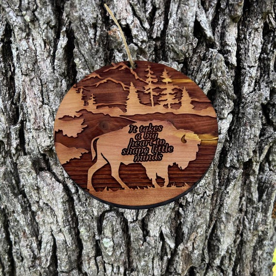 BISON it takes a big heart to shape little minds - Cedar Ornament BISON it takes a big heart to shape little minds - Cedar Ornament
