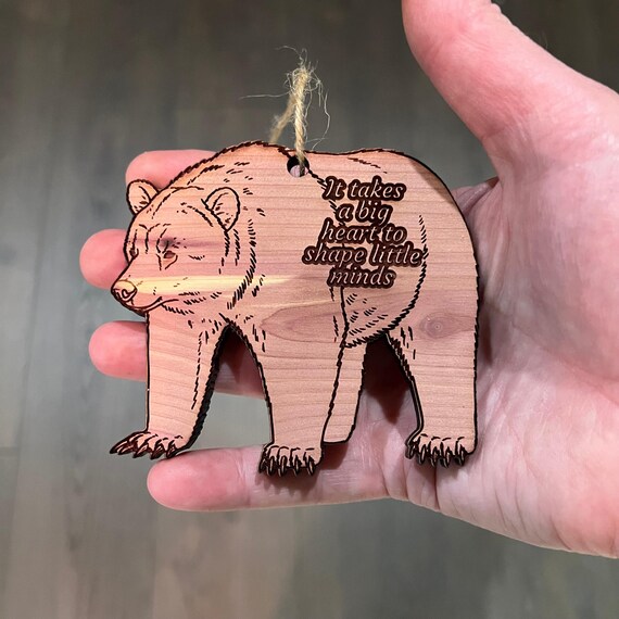 GRIZZLY BEAR it takes a big heart to shape little minds - Cedar Ornament GRIZZLY BEAR it takes a big heart to shape little minds - Cedar Ornament