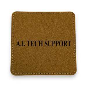May include: A brown leather coaster with the text "A.I. Tech Support" in black.