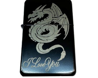 May include: Black lighter with a silver engraved dragon design and the words "I Love You" on the bottom.