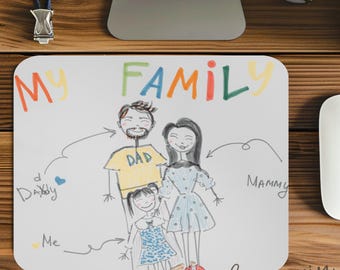 May include: A white mouse mat featuring a hand-drawn family portrait with the words "My Family" in colourful letters. The illustration depicts a father, mother, and child, with labels such as "Dad", "Mammy", and "Me".