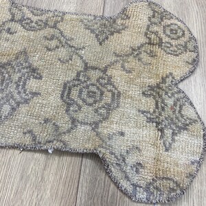 Handmade colorful Turkish Kilim pet mats, boho upcycled rug designed for pets, unique bone-shaped feeding mat, durable woven fabric, eco-friendly recycled carpet, decorative home accent, vibrant patterns and textures, comfortable and easy-to-clean, perfect for indoor or outdoor use, adds charm to any pet feeding area, ideal gift for pet lovers, artisanal inspired Turkish weave, stylish addition to pet space, one-of-a-kind handmade design.