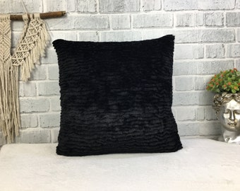 black couch with pillows