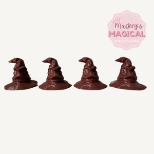 May include: Four brown Sorting Hat replicas, a popular item from the Harry Potter series. The hats are made of a smooth, solid material and are approximately 3 inches tall.