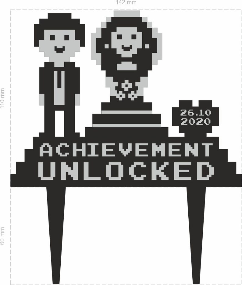 May include: Black and grey cake topper with pixelated figures and text. The topper features a man in a suit, a trophy, and the words "ACHIEVEMENT UNLOCKED" with the date "26.10 2020". The topper is 14.2 cm wide and 11 cm high.