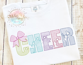 May include: White t-shirt with a rainbow coloured "CHEER" design. The letters are outlined with a stitch and each letter is filled with a silhouette of a cheerleader. The "C" has a pink bow.