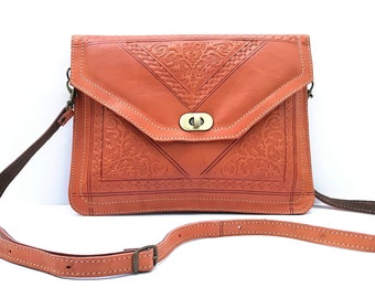 Clutch handbag in genuine full grain leather