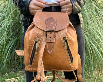 Sac à dos en cuir véritable multipoches porté épaule