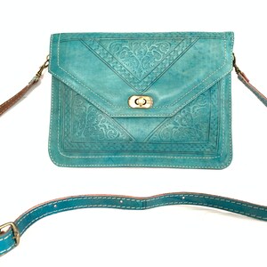 Bolsa clutch em couro legítimo com alça de ombro