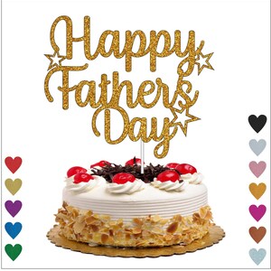 May include: Gold glitter cake topper with the text "Happy Father's Day" and stars. The topper is on top of a white cake with red cherries and a brown chocolate base.