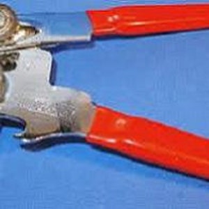 May include: A manual can opener with red and blue plastic handles and a silver metal body.