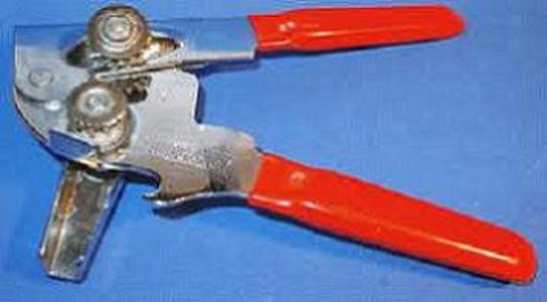 May include: A manual can opener with red and blue plastic handles and a silver metal body.