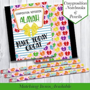 May include: Composition notebook with the name "ALAYAH" and the phrase "MAKE TODAY GREAT". The notebook has a pink cover with colorful bow patterns and blue striped pages. Matching pencils with the name "ALAYAH" are also visible.