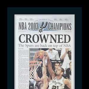 San Antonio Spurs / Tim Duncan - 2003 NBA Title - San Antonio Express Newspaper - &quot;CROWNED&quot; - Double Matted, Framed in Authentic Team Colors