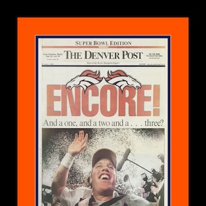 Denver Broncos - 1999 NFL Super Bowl Champions - Denver Post Newspaper - &quot;ENCORE!&quot; - Double Matted & Framed in Authentic Team Colors