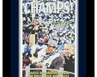 Seattle Seahawks - 2014 NFL Super Bowl Champions - Seattle Times Newspaper - "CHAMPS!" - Double Matted & Framed in Authentic Team Colors