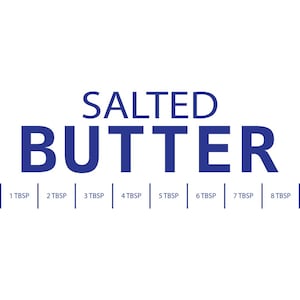 May include: A white rectangular label featuring the dark blue text SALTED BUTTER in a bold sans-serif font. Below the text, a horizontal measurement scale is marked with vertical lines and labels from 1 TBSP to 8 TBSP for portioning.