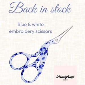May include: Embroidery scissors featuring a blue and white floral pattern on the handles and silver metal blades. The text "Back in stock", "Blue & white embroidery scissors", and "PunchyStuff STUDIO" are visible on the image.