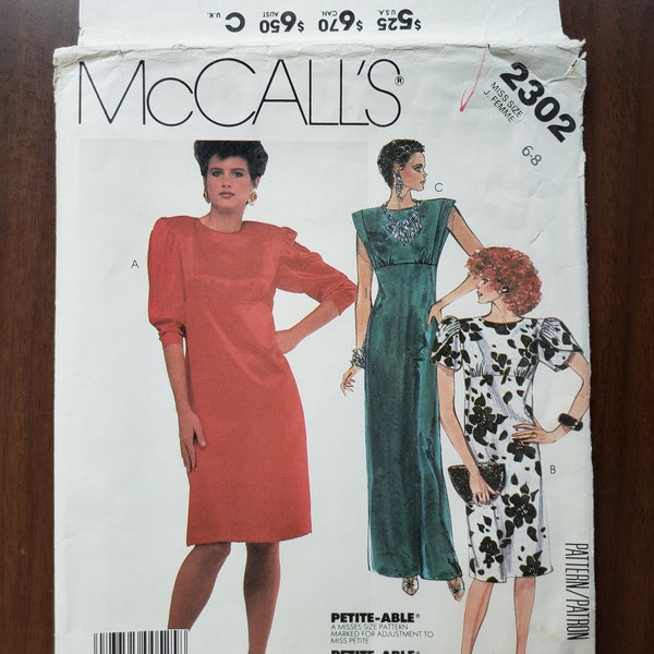 Vintage 1985, uncut sewing pattern. Misses' dress. McCall's 2302, size 6-8. Straight, empire-waist, front gathers, back zipper, shoulder pad