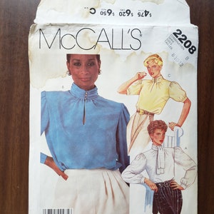 May include: A vintage McCall's sewing pattern for a blouse, with three different styles shown. The pattern number is 2208 and the sizes are 8, 10, and 12. The pattern is for a combination series.