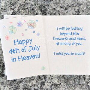 May include: A white card with blue text that reads "Happy 4th of July in Heaven!" with a colorful firework design. The back of the card has blue text that reads "I will be looking beyond the fireworks and stars, thinking of you. I miss you so much!"