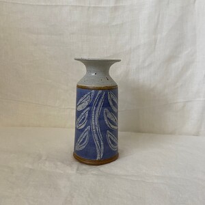 Purple ceramic vase with leaf design